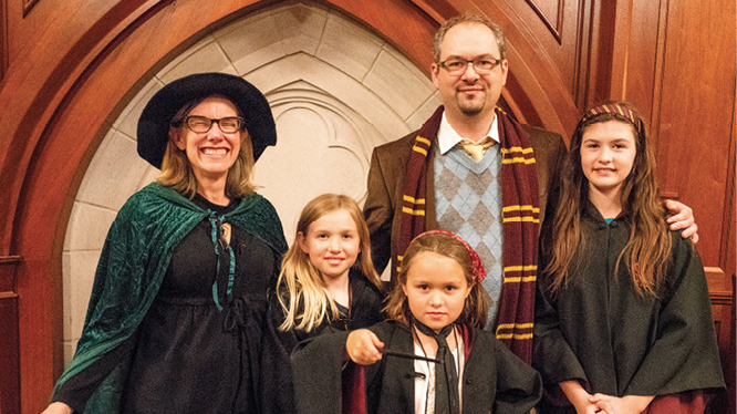 Professor Sarah Igo (left) gets into the spirit of the evening with her husband, Ole Molvig, assistant professor of history and of communication of science and technology, and their children, Eleanor (12), Greta (10) and Hattie (8).