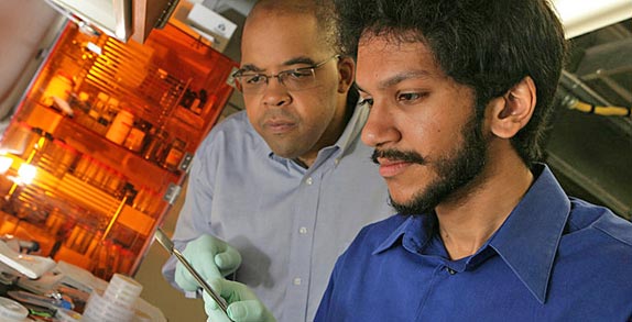 Physicist James Dickerson, left, and graduate student Saad Hasan (Photo by Daniel Dubois)
