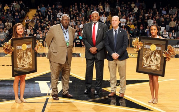 Vice Chancellor for Athletics and University Affairs and Athletics Director David Williams helped recognize Vanderbilt basketball great Perry Wallace (center) and author Andrew Maraniss during halftime of the Dec. 4 men's basketball game. (Steve Green/Vanderbilt)