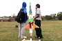 Seventh grade students at Wright Middle School in Nashville standing next to their brightly decorated soda bottle rocket sitting on the launch pad.