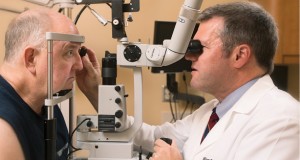 Dr. Milam Brantley Jr., right, examines patient David Nipper at the Vanderbilt Eye Institute. Brantley and colleagues are working to identify methods to determine
a person’s risk for developing diseases that cause blindness. (JOE HOWELL)