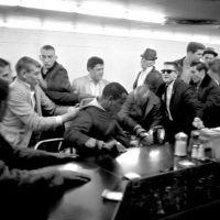 Several men attempt to drag a nonviolent student sit-in demonstrator from his stool at the lunch counter in the upstairs section of Woolworth’s on Fifth Avenue North. February 27, 1960. Photo by Vic Cooley. Nashville Banner Archives, Nashville Public Library, Special Collections