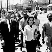 On April 19, 1960, the day of the Z. Alexander Looby bombing, as many as four thousand demonstrators marched down Jefferson Street toward city hall. In the first row are Rev. C. T. Vivian (left), Diane Nash of Fisk, and Bernard Lafayette of American Baptist Seminary. In the second row are Kenneth Frazier and Curtis Murphy of Tennessee A&I, and Rodney Powell of Meharry. Using his handkerchief in the third row is Rev. James Lawson. Photo by Jack Corn. Courtesy of The Tennessean