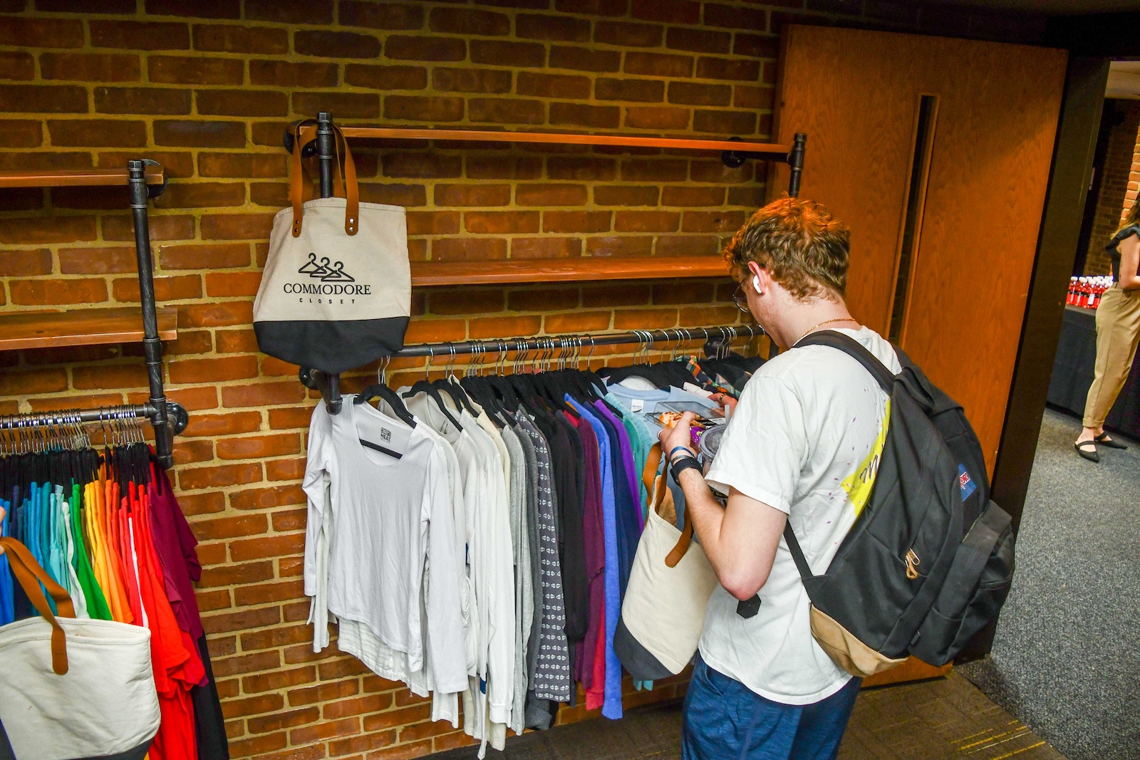 A student shops in the Commodore Closet.