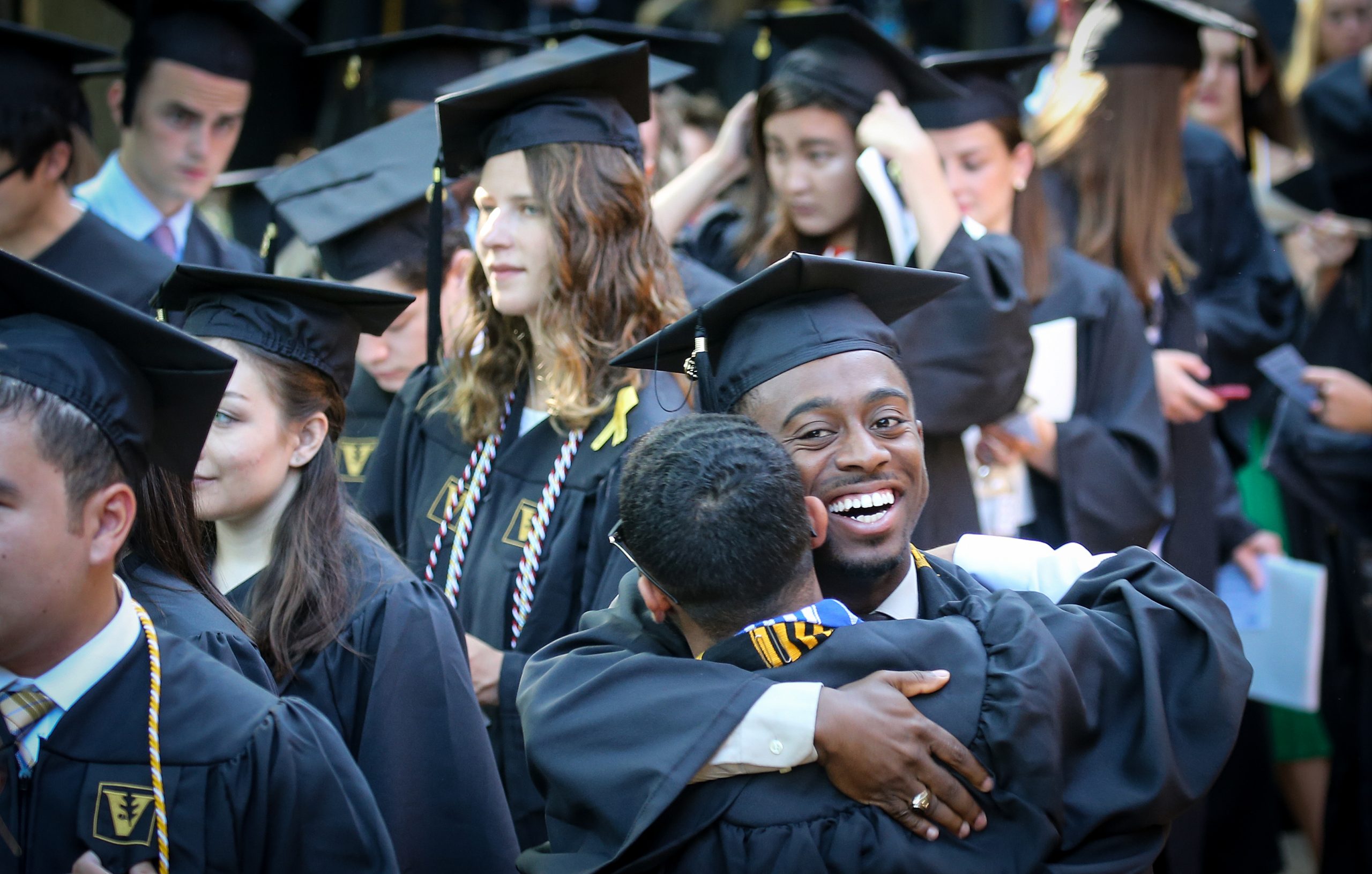 Two Vanderbilt graduates celebrating Commencement. 