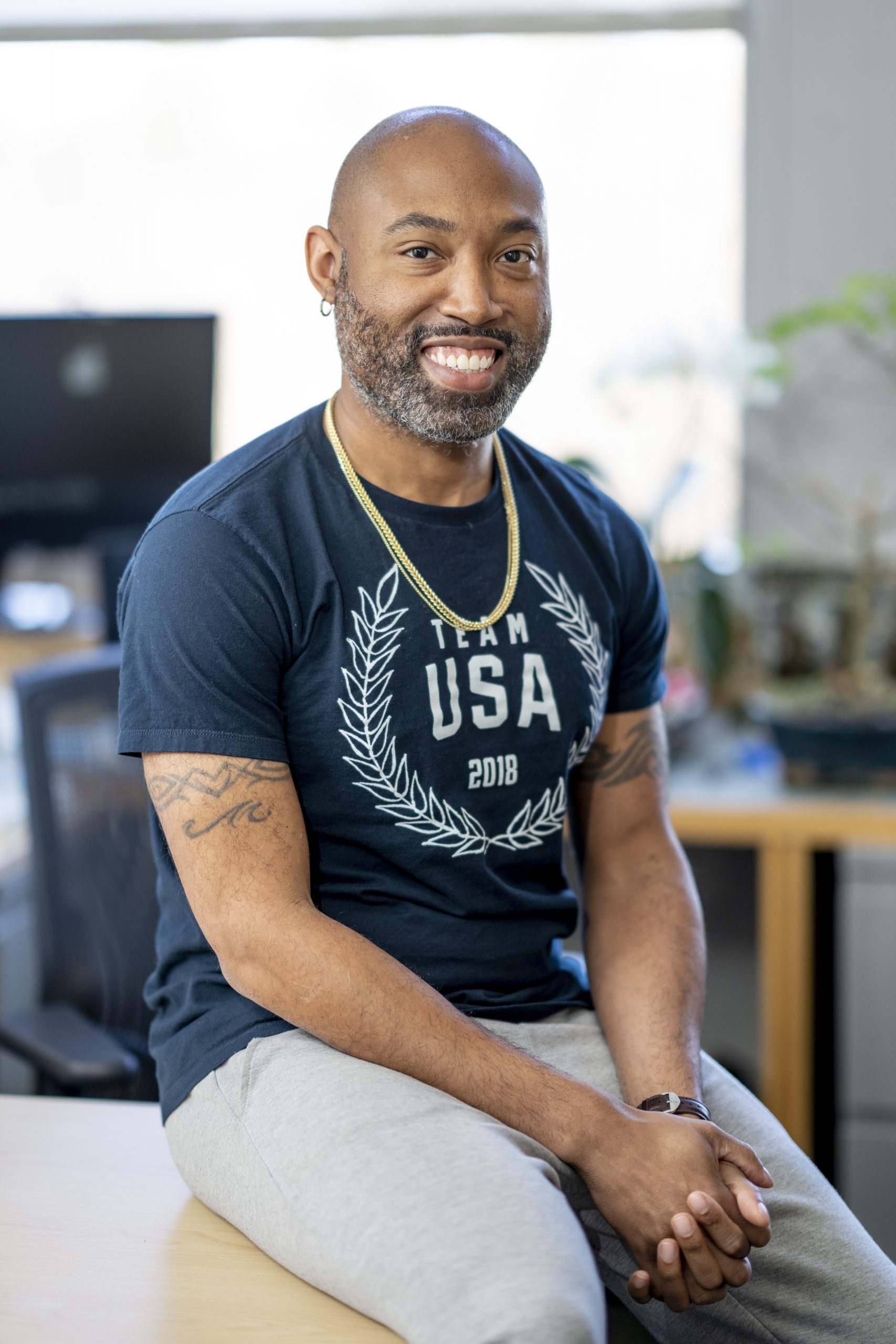 A man sitting on a desk