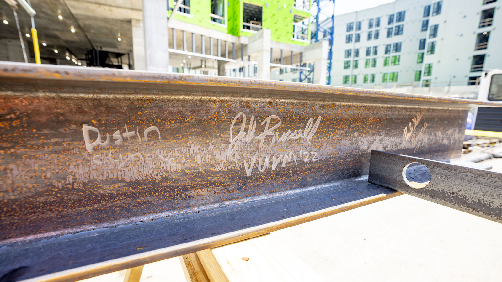 Graduate and professional student housing project building beam used during the topping out ceremony