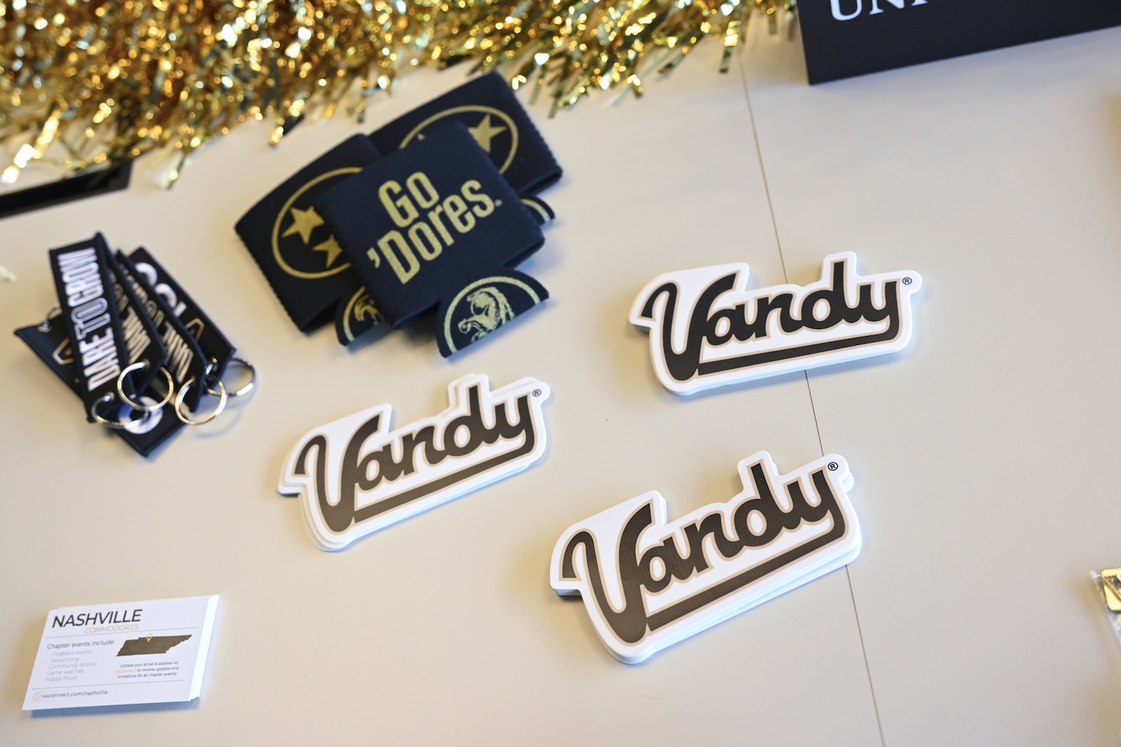 Vanderbilt promotional items, including keychains and koozies. 