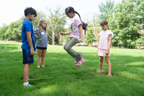 Students conduct a jumping experiment outdoors