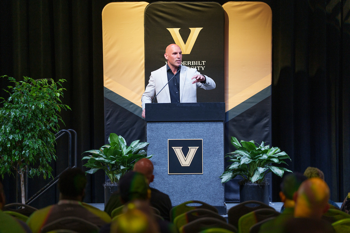 A man standing at a podium on a stage