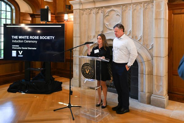 A man and a woman stand at the podium