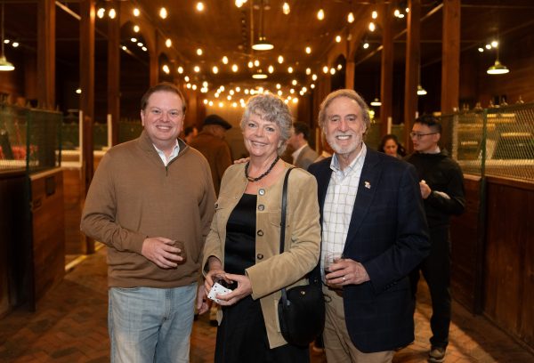 Damon Andrew, Camilla Benbow and Rick Ginsberg pose during an evening event.
