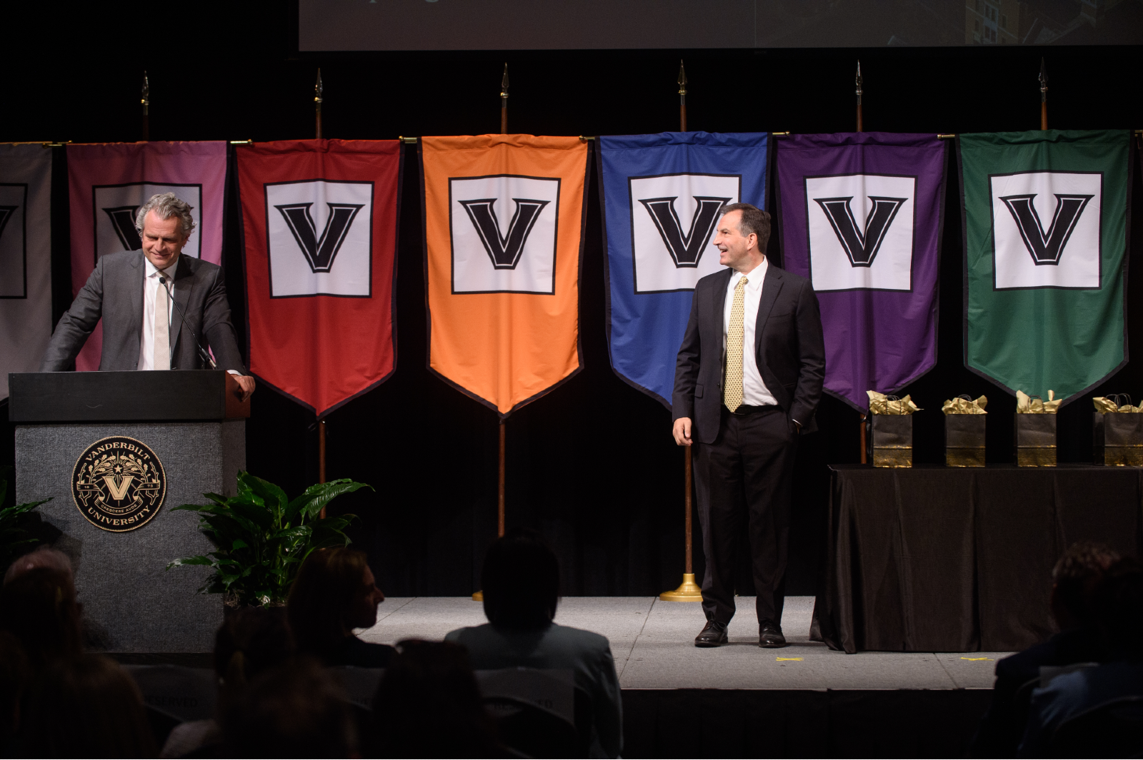 Chancellor Daniel Diermeier at podium assisted by Vice Chancellor Eric Kopstain for staff awards presentation