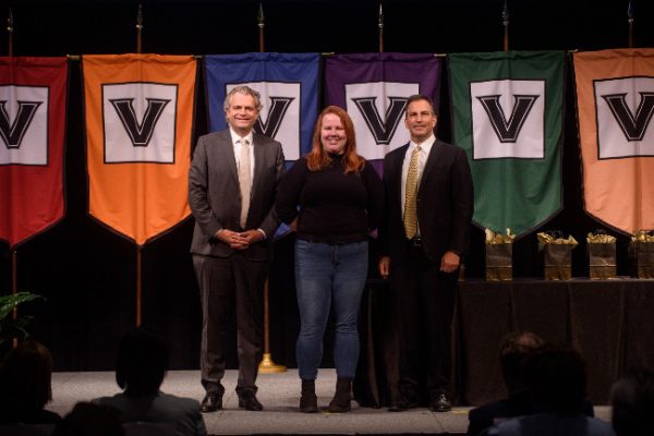 Chancellor Daniel Diermeier and Vice Chancellor Eric Kopstain present Early Impact Award to Paige Snay