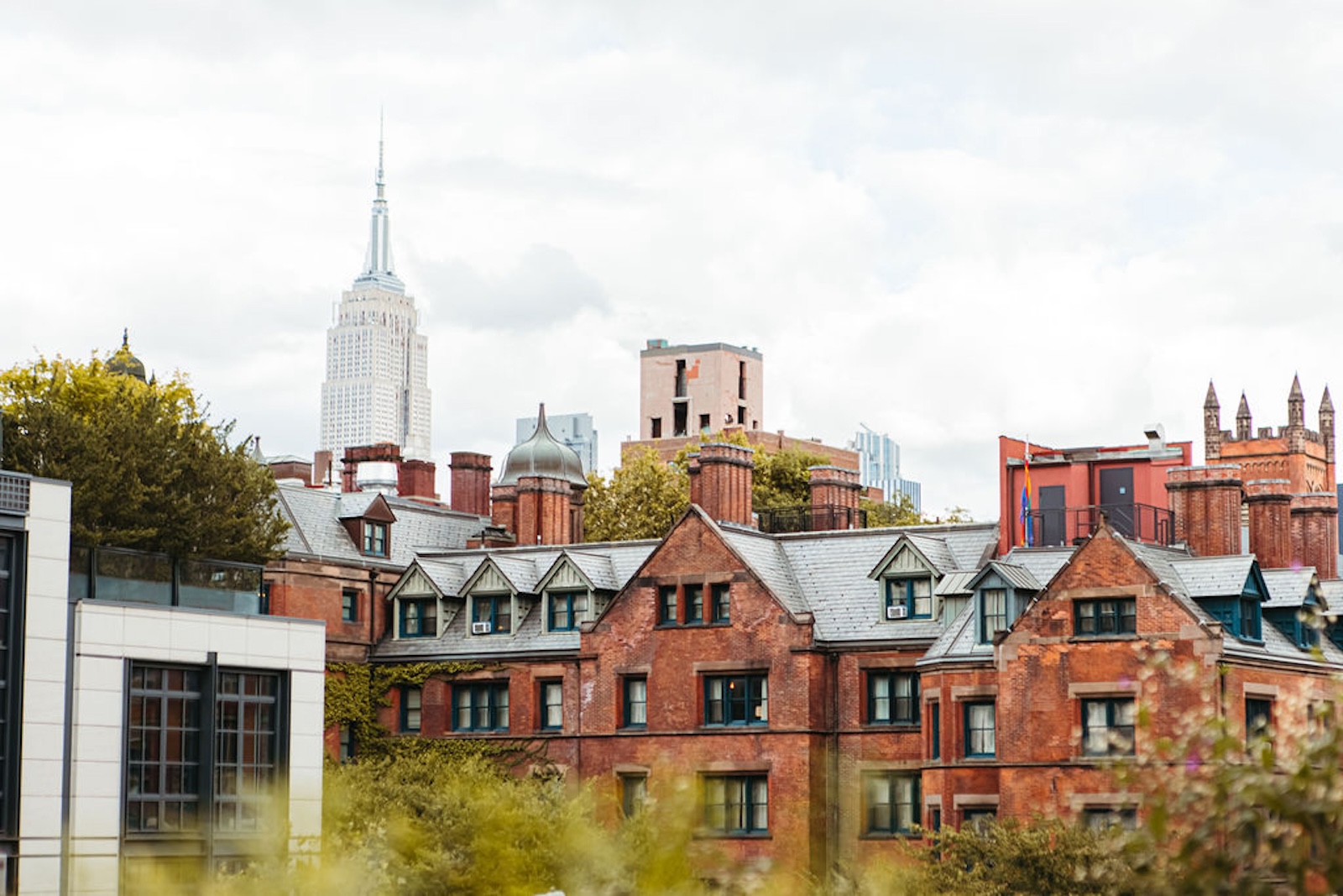 A skyline of brick buildings on a gray day.