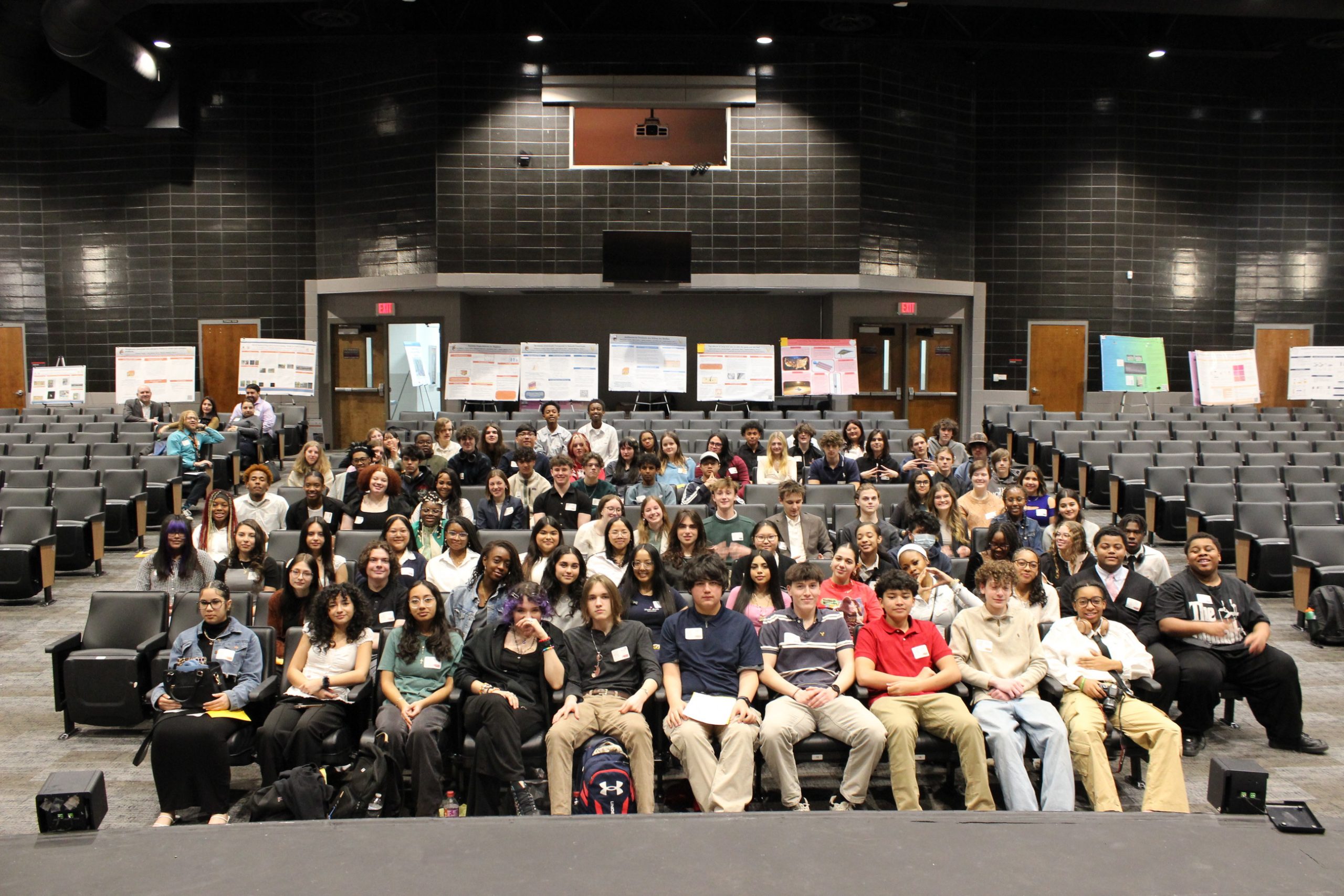 High school students of the ISR research symposium sitting in an auditorium