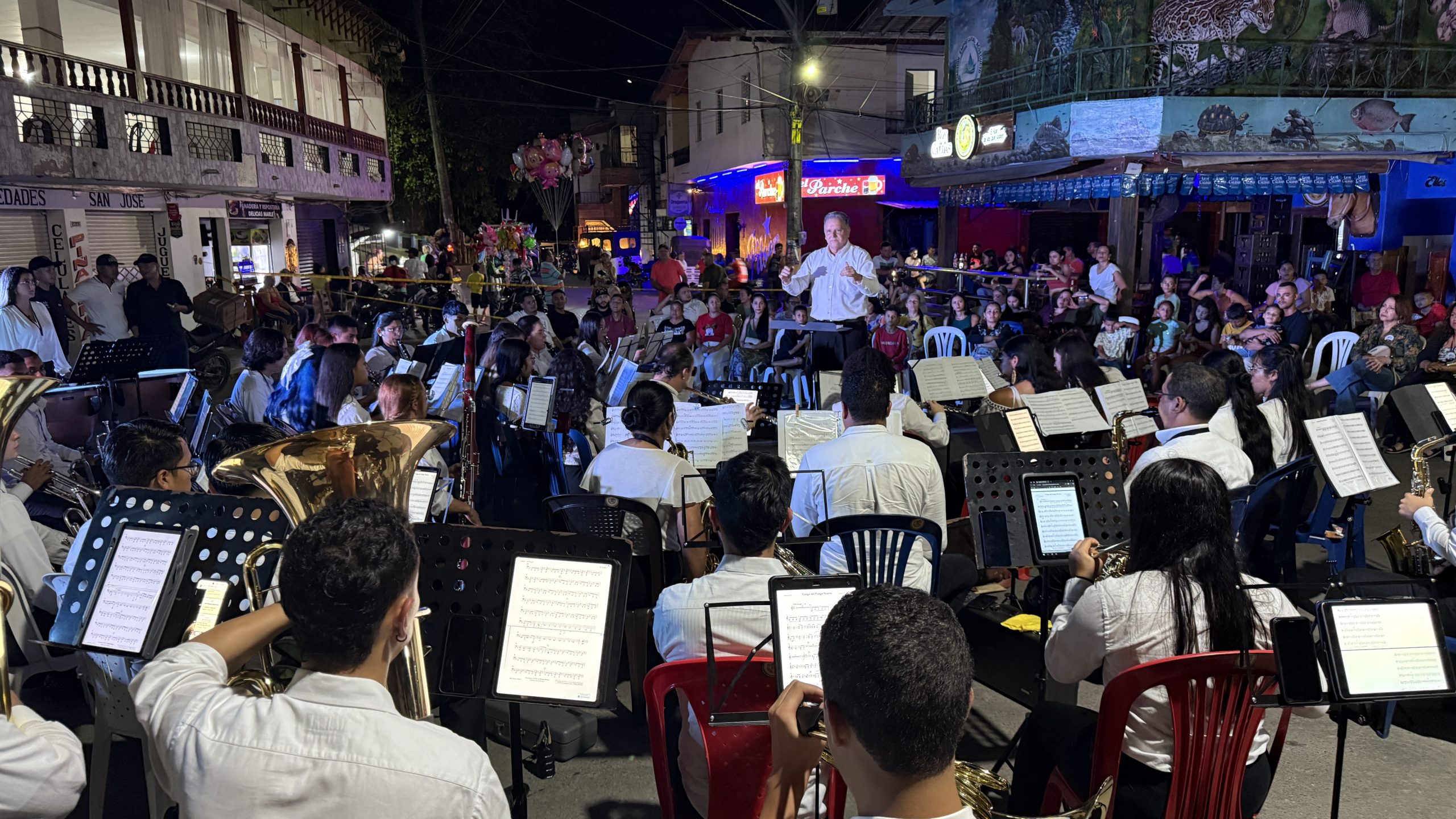 Musicians playing in a public concert outdoors.
