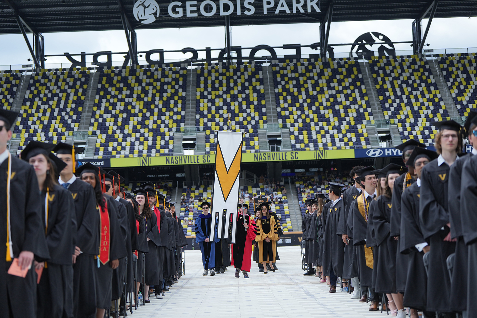 Faculty and emeriti faculty process into GEODIS Park during Vanderbilt University's Commencement 2024. (Vanderbilt University)