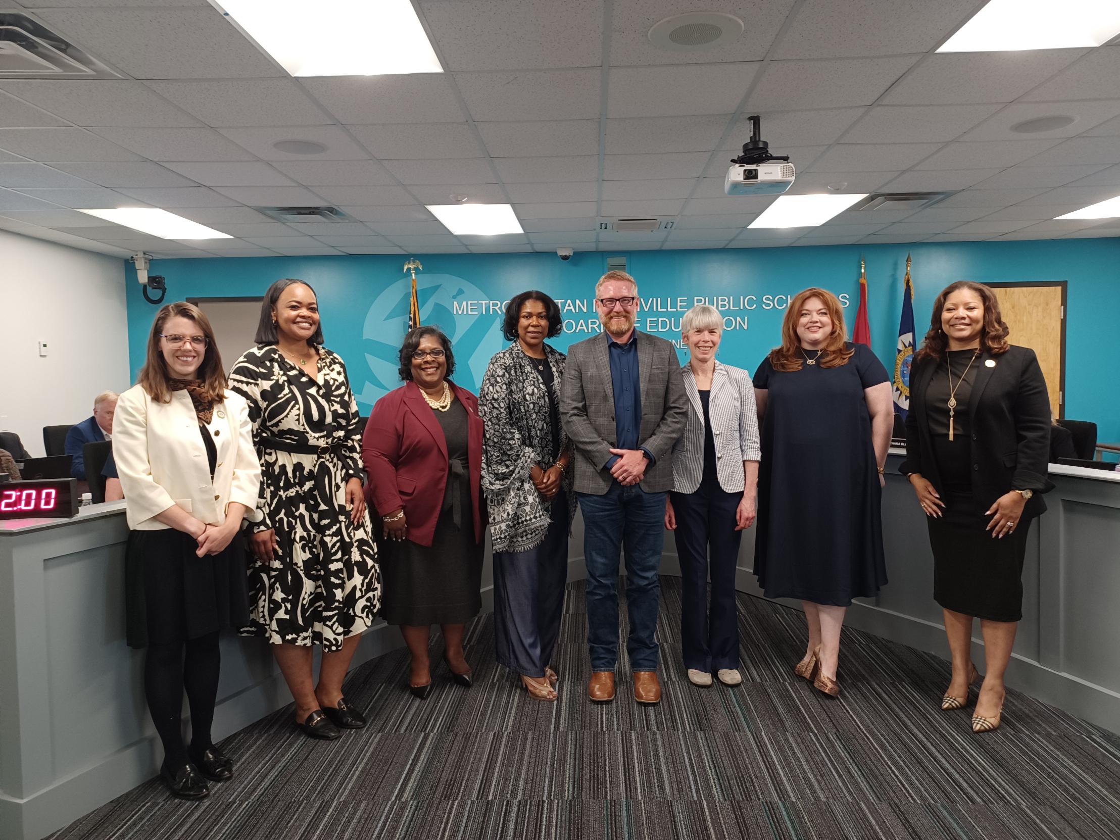 Peabody College faculty members Andrew Hostetler (center) and Marcy Singer-Gabella (center right) with representatives of MNPS, including Director Adrienne Battle (far right), following the school board announcement on April 23.
