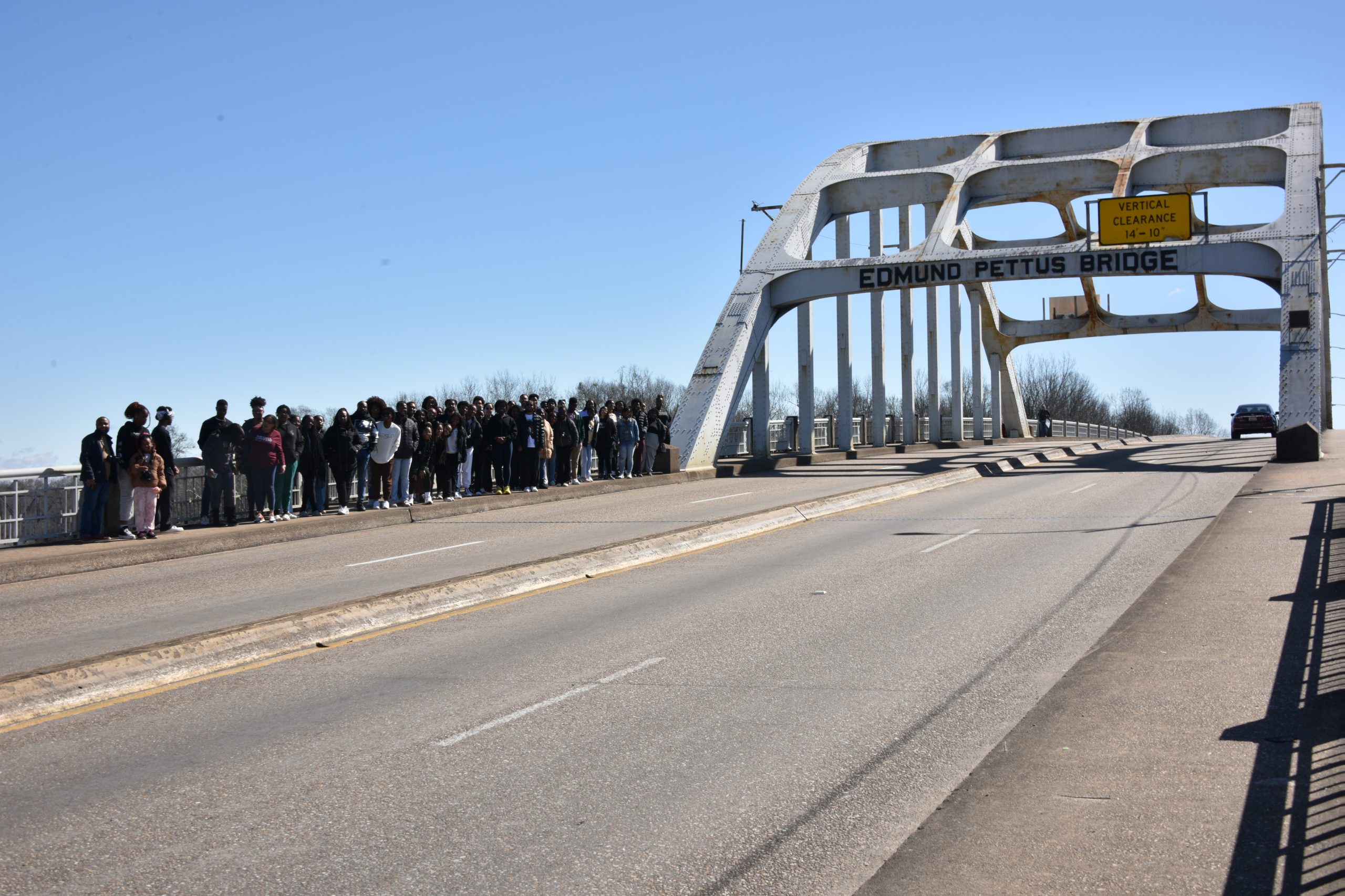 Excursion participants crossing the historic Edmund Pettus Bridge.