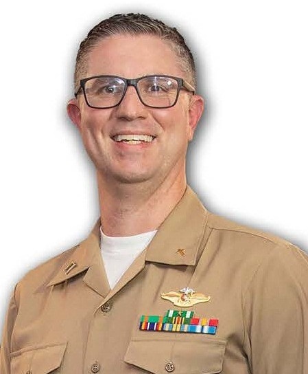 photograph of Chris Terrell in khaki-colored navy uniform
