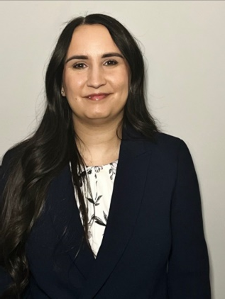 woman wearing blue suit and white blouse with flower prints