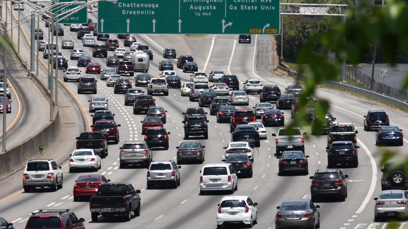 Cars navigate traffic on a busy road