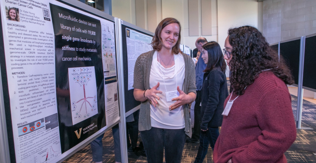 Katie Young (left), a postdoctoral fellow in the Reinhart-King Lab, presents her poster at the 16th annual VPA symposium.