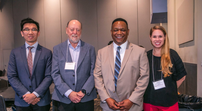 L-r: Zhiyu Wan, a postdoctoral fellow in the Malin lab; Dr. Jack Dongarra, keynote speaker; André Christie-Mizell, vice provost for graduate education; and Faith Bishop, associate director, Office of Postdoctoral Affairs.