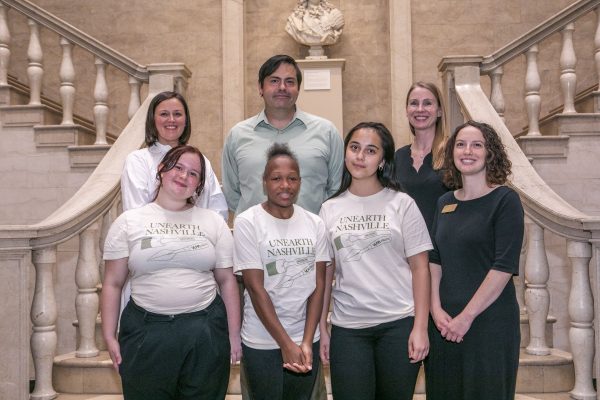 Amanda Hellman, Adam Fracchia, Menton Deweese (top) Avery Weber, Mumtoza Abdusattorova, Lydia Harrell and Rachelle Wilson (bottom) stand inside the VUMA.