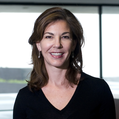 woman with brown medium length hair in black V-neck shirt