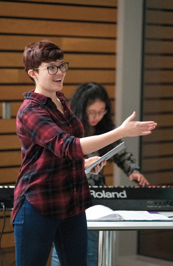 Senior Sarah Clements sings—accompanied by sophomore Calendula Cheng at the keyboards— during the dress rehearsal for January’s concert A Humming Under My Feet. Photo by Joe Howell