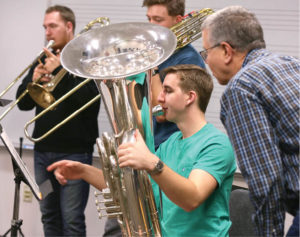 Left to right: Isaac Johnson (trombone), Sam Anderson (trombone) and Pierce O’Brien (tuba) are coached by Gilbert Long, adjunct associate professor of tuba. Photo by Anne Rayner