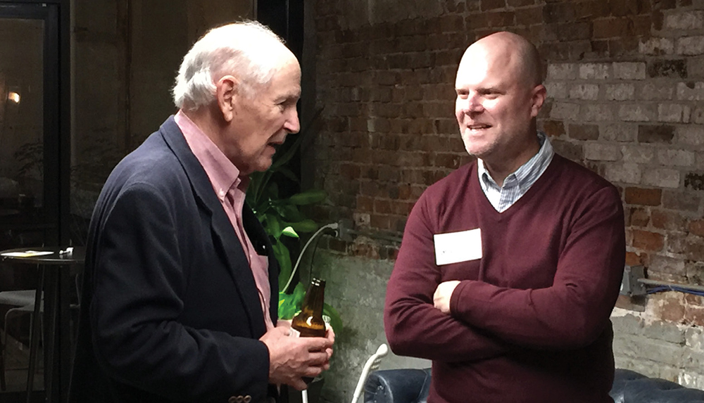 Alan Hicks, BA’66, left, speaks with Strong Inside author Andrew Maraniss, BA’92, at the San Francisco Commodore Classroom event.