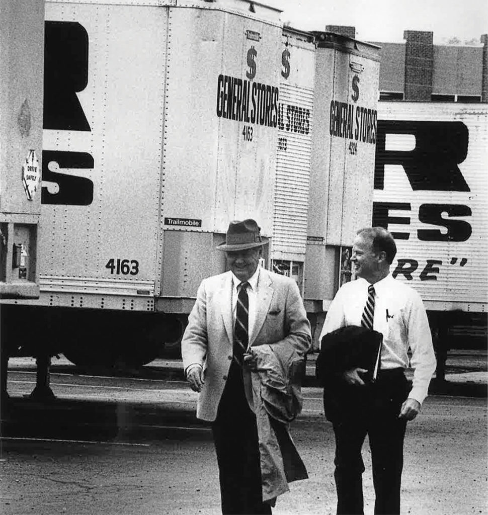 photo of Cal Turner Sr. and Cal Turner Jr. in front of Dollar General trucks