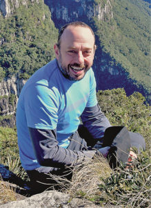photo of Guilherme Gualda on a mountain trail