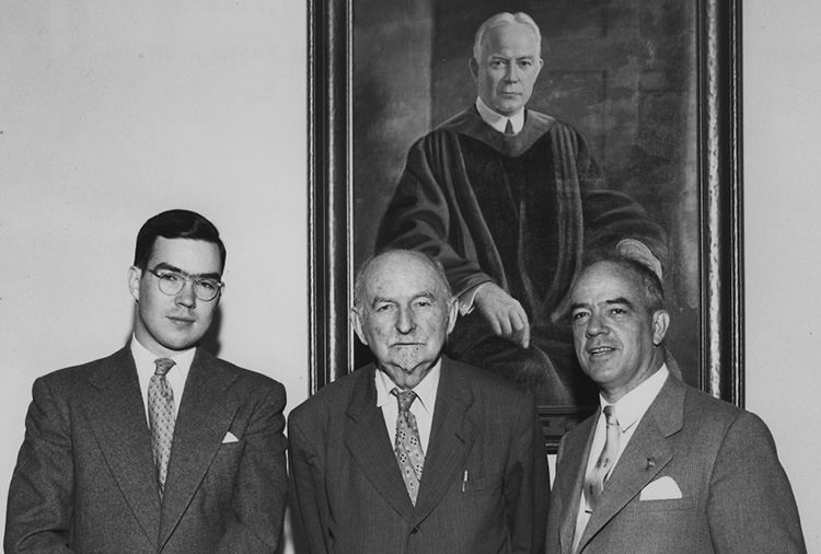 Carr Payne Jr., Edwin Mims, Vanderbilt Professor of English, and Carr Payne Sr. at the dedication of Payne Hall in 1953, with the painting of former Peabody president Bruce R. Payne behind them. Photo courtesy of Vanderbilt University Special Collections
