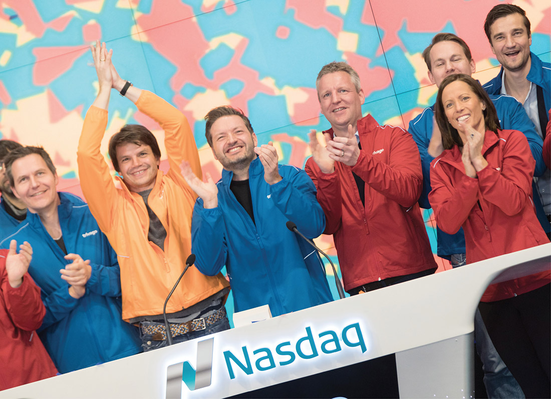 Friedman, right, celebrates the opening bell with executives from travel company Trivago on Dec. 16, 2016, the first day its shares began trading on Nasdaq. (COURTESY OF NASDAQ)