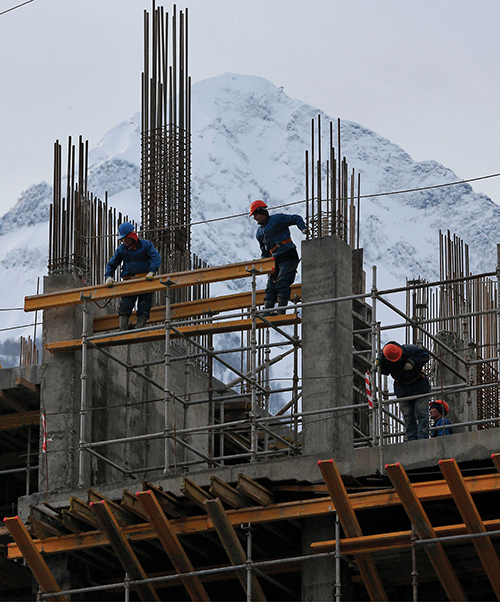 photo of workers constructing a building in Sochi, Russia