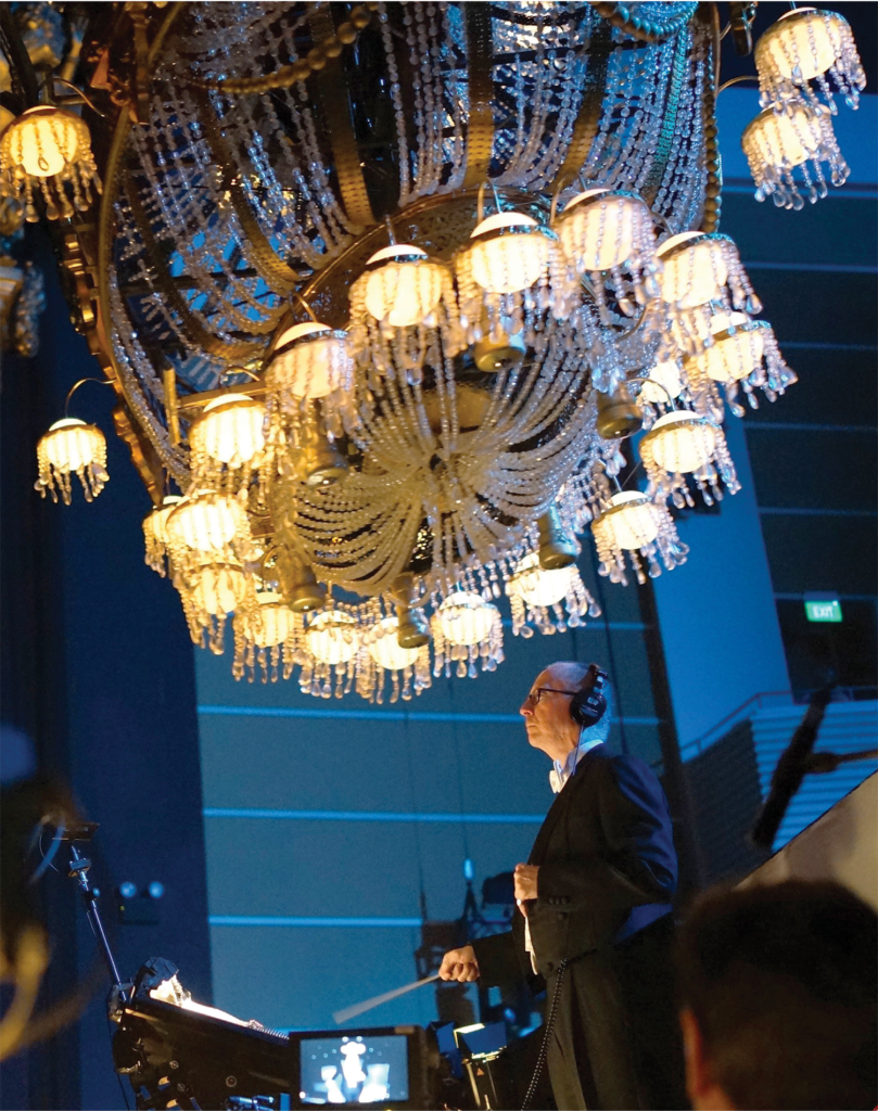 As music director for the world tour of Phantom of the Opera from 2012 to 2016--and as associate music supervisor for seven international companies of the production--Stan Tucker, BMus'73, has felt the whoosh of the show's iconic falling chandelier hundreds of times as it landed inches from his head. Photo courtesy of stantucker.net