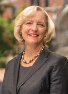 photo of Susan R. Wente in front of Kirkland Hall