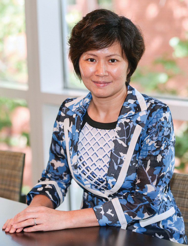 Portrait shot of Xiaoyan Jiang in front of a window